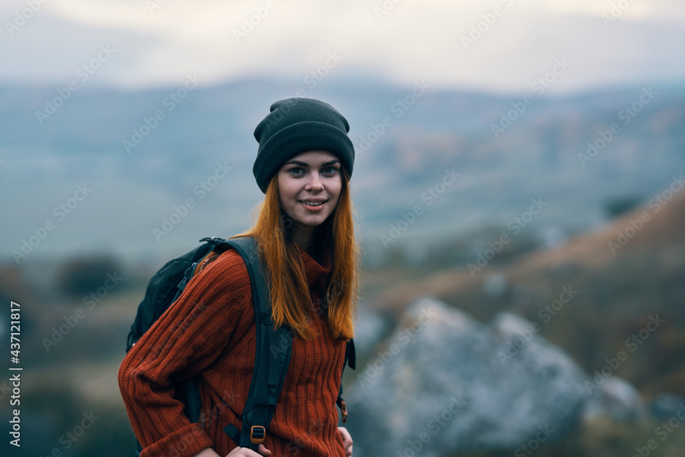cheerful woman hiker in the mountains outdoors vacation transportation travel