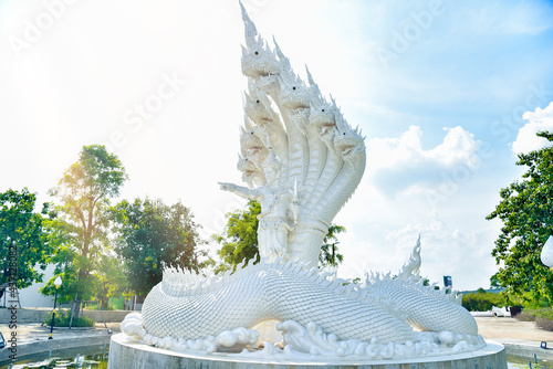 A sculpture depicting a male naka withe Giant Naga statue photo