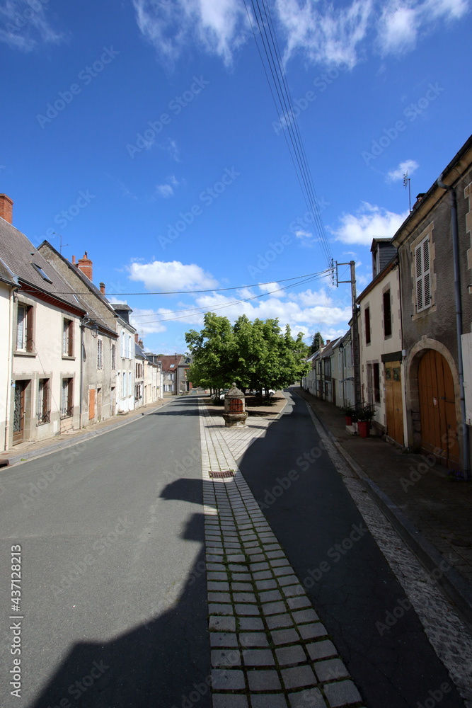 A French street with a communal well.