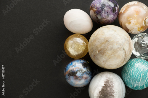 Crystal stone set on black background with space for your copy. Gemstones and crystals on dark background.
