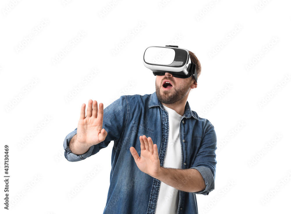 Emotional man using virtual reality headset on white background Emotional man using virtual reality headset on white background