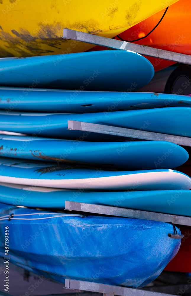 bunch of piled blue surfboards