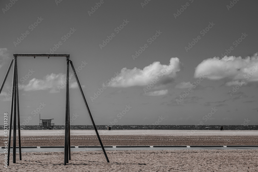 swing on the beach and dark sky swing on the beach and dark sky
