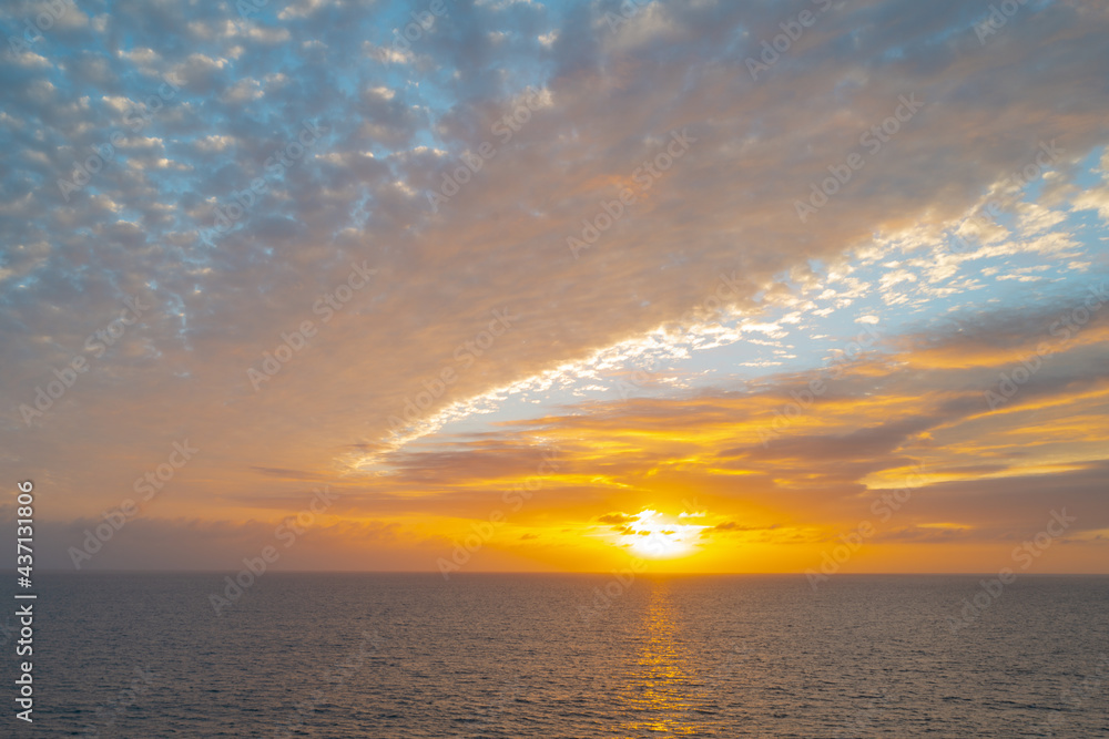 Sunrise over the sea and beautiful cloudscape. Colorful ocean beach sunset. Sunrise over the sea and beautiful cloudscape. Colorful ocean beach sunset.