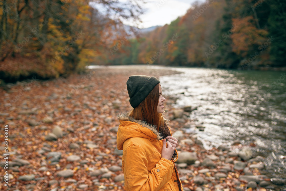 woman in the forest river fallen leaves travel landscape woman in the forest river fallen leaves travel landscape