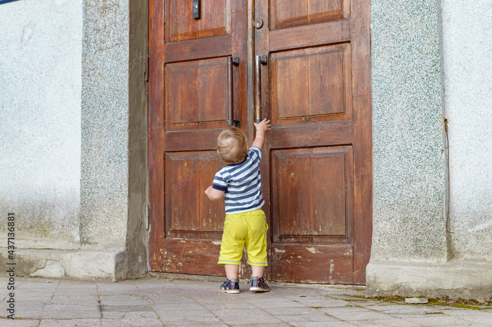 child pulling on the door child pulling on the door