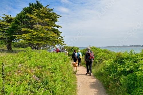 group of senior hikers on the path at "Ile Grande" in Brittany. France
