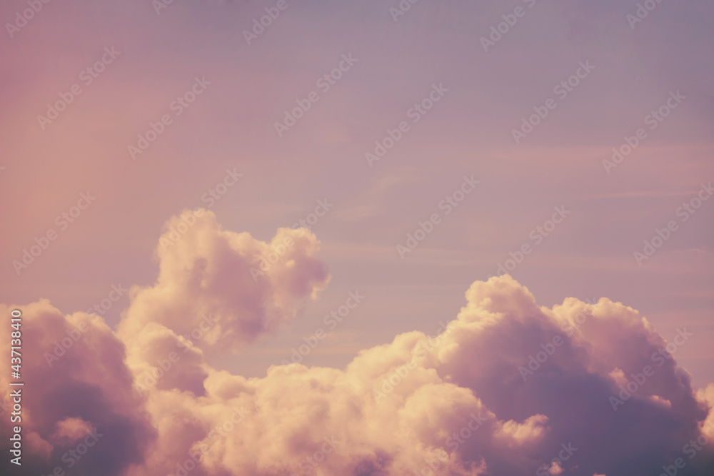 Pink clouds in a blue sky, copy space for text Pink clouds in a blue sky, copy space for text