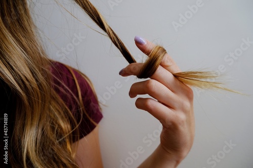 Woman twirling her hair photo