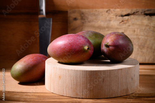 Fresh palmer mango on wooden background, Tropical fruit photo