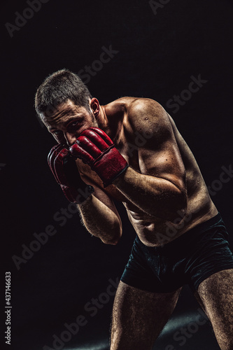 MMA Fighter with boxing gloves © Spanic