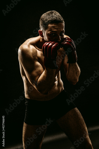MMA Fighter with boxing gloves © Spanic