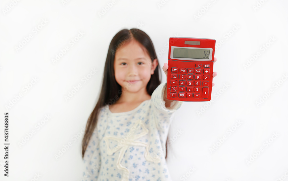 Asian little girl child showing Calculator over white background. Kid holding a red calculator. Selective focus at calc Asian little girl child showing Calculator over white background. Kid holding a red calculator. Selective focus at calc