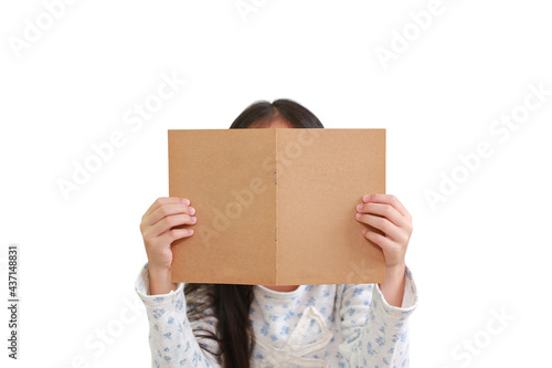 Caucasian little girl child reading book over white background. Kid holding brown book cover hide her face - Clipping path © zilvergolf