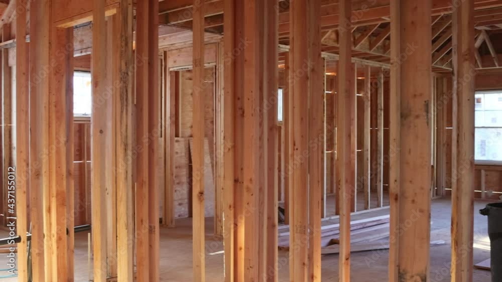 Aerial view of exterior unfinished a house residential construction wall on framing against Aerial view of exterior unfinished a house residential construction wall on framing against