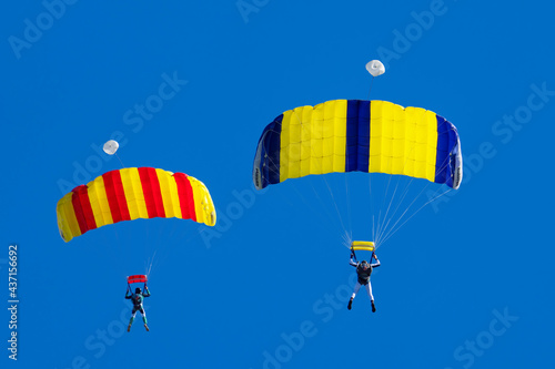 parachutists against a blue sky. photo