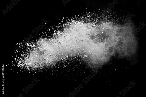 Freeze motion of white color powder exploding on white background.