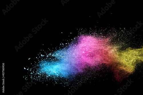 Colorful powder explosion on black background.