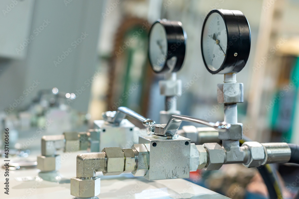 Fototapeta premium A valve with a valve in the hydraulic power system of industrial equipment.