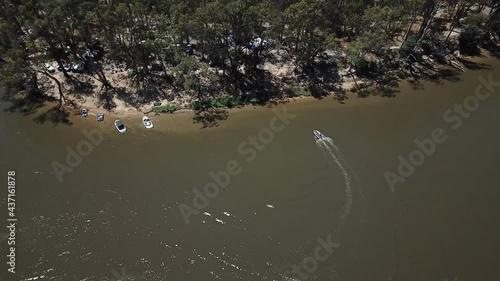 Drone aerial pan up muddy dirt river in Australia photo