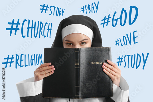 Young nun with Bible on lig...