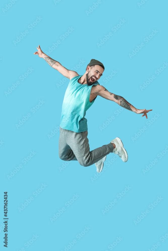 Jumping young man on color background Jumping young man on color background