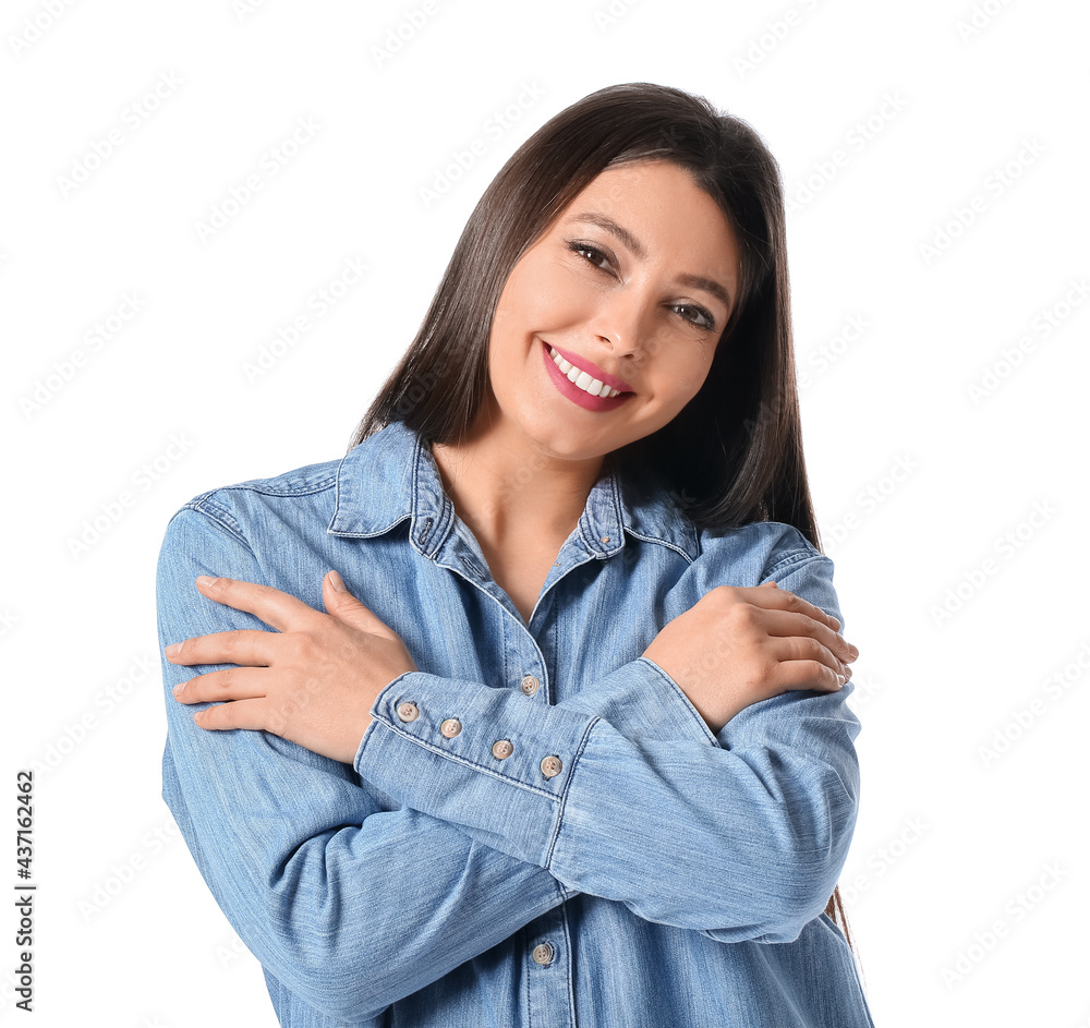 Young woman hugging herself on white background Young woman hugging herself on white background