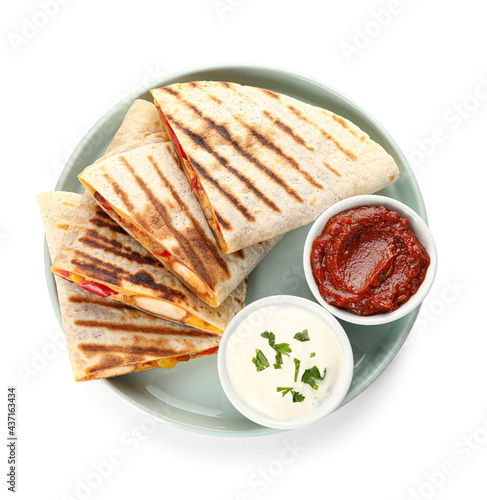 Plate with tasty quesadillas and sauces on white background photo