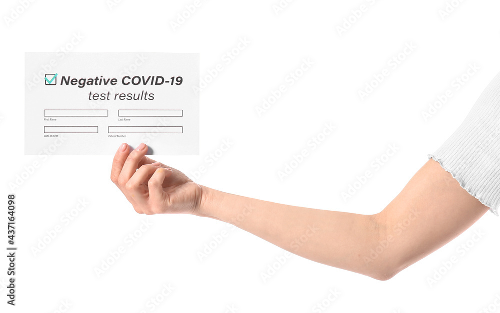 Hand of young woman with negative covid-19 test result on white background Hand of young woman with negative covid-19 test result on white background