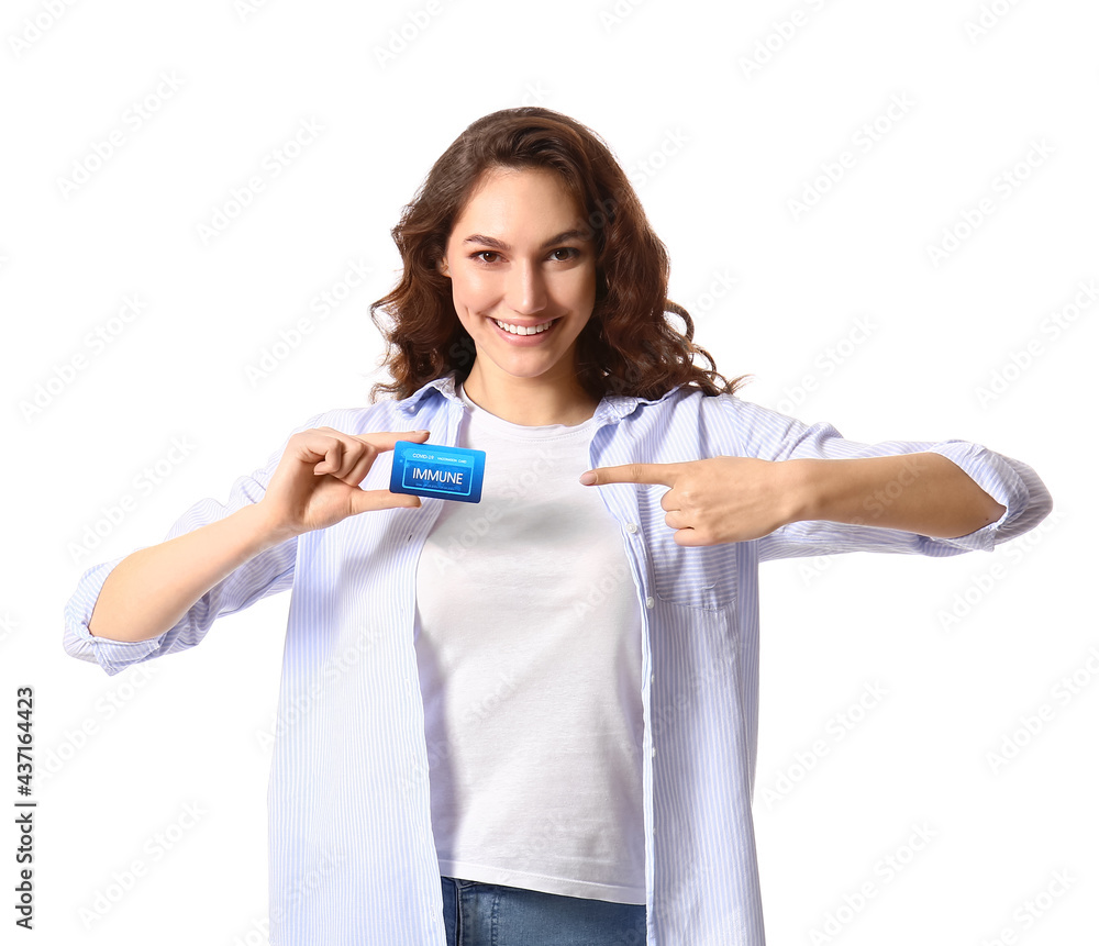 Young woman pointing at vaccination card on white background Young woman pointing at vaccination card on white background