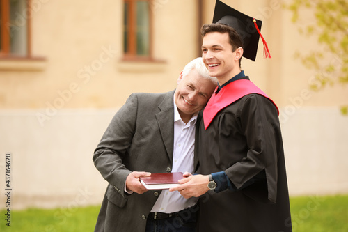 Happy young man with his fa...