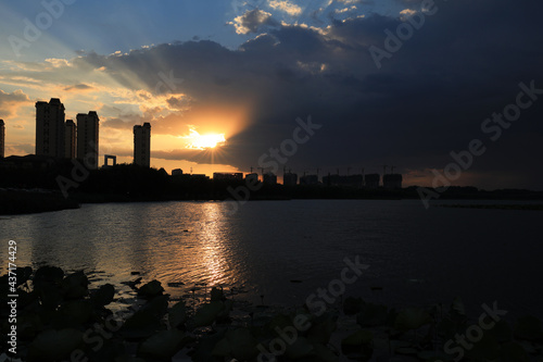In the evening, the architectural scenery of the city is near the water, North China