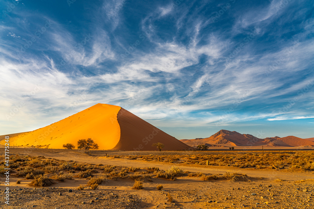 Landscape from the large sand dunes with dune 45 at Sossusvlei during sunrise Landscape from the large sand dunes with dune 45 at Sossusvlei during sunrise