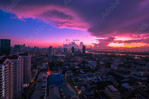 The high angle background of the city view with the secret light of the evening  blurring of night lights  showing the distribution of condominiums  dense homes in the capital community