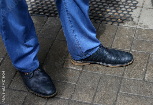 Leather shoes on the legs of a man