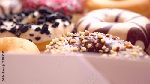 Assortment of donuts of different flavors in a box. 