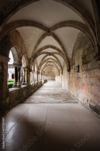 Archway of an old monastery. Cloisters of Batalha Monastery © nvphoto