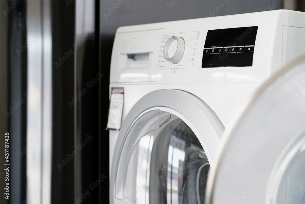 Close up of new dryer machine in household appliances store Close up of new dryer machine in household appliances store