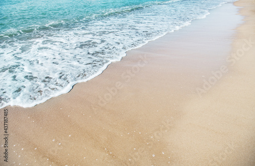 Wave of the sea on the sandy beach