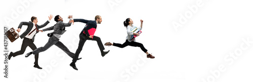 Four happy office workers jumping in casual clothes with folders on white studio background. Business concept.