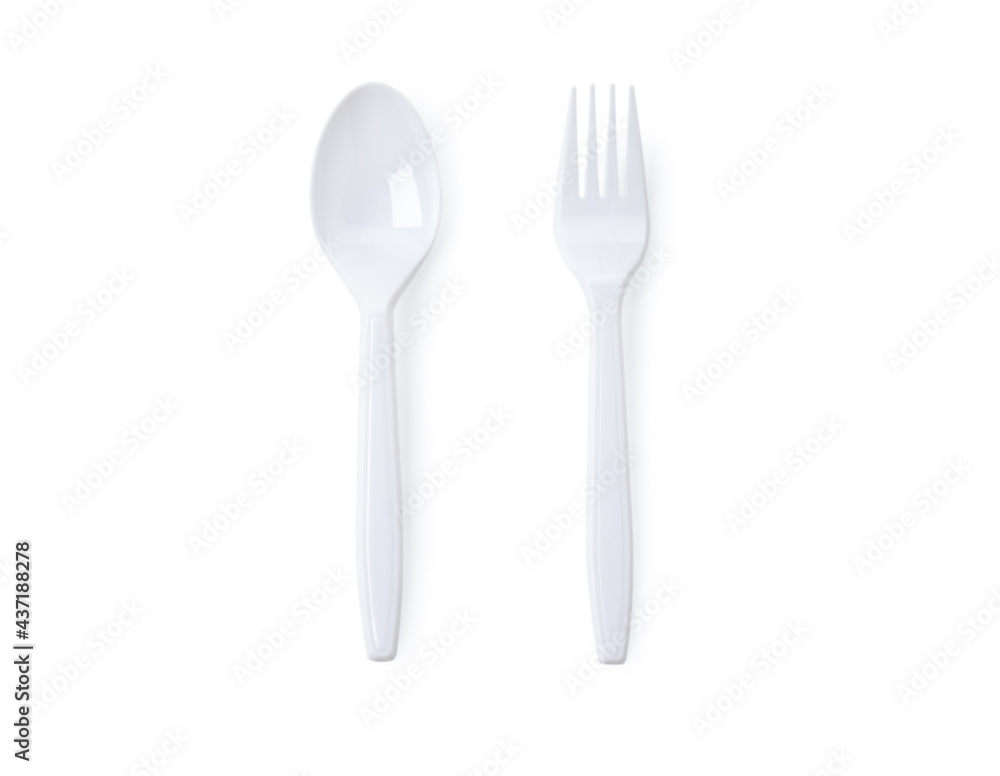 White plastic spoon with fork on white background White plastic spoon with fork on white background