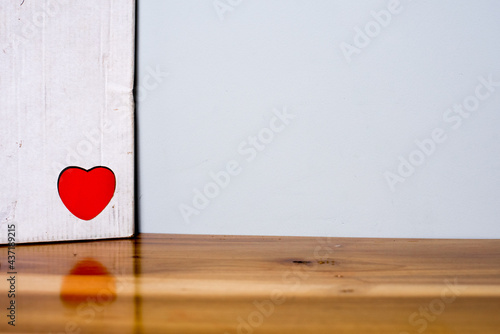 red heart on wooden background