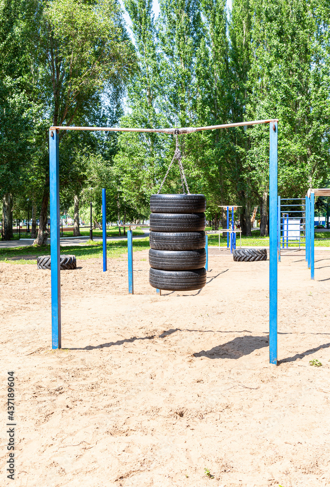 Car tires for sports training are suspended on chains Car tires for sports training are suspended on chains