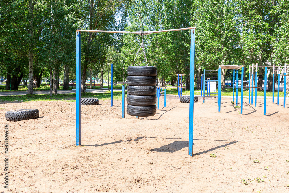 Car tires for sports training are suspended on chains Car tires for sports training are suspended on chains