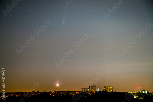 Germany, Stuttgart, July 2020, Comet neowise above the skyline and tv tower fernsehturm building of stuttgart city by night