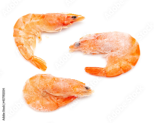 Frozen red shrimps on a white plate.