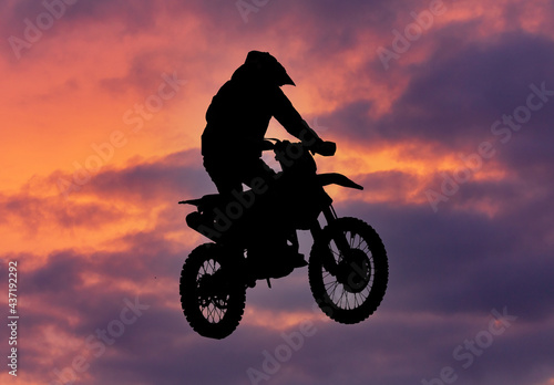 Silhouette of a man on a motorcycle © schankz