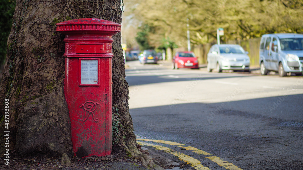 Photo of a 120-year old traditional British post box being swallowed up by a tree Photo of a 120-year old traditional British post box being swallowed up by a tree