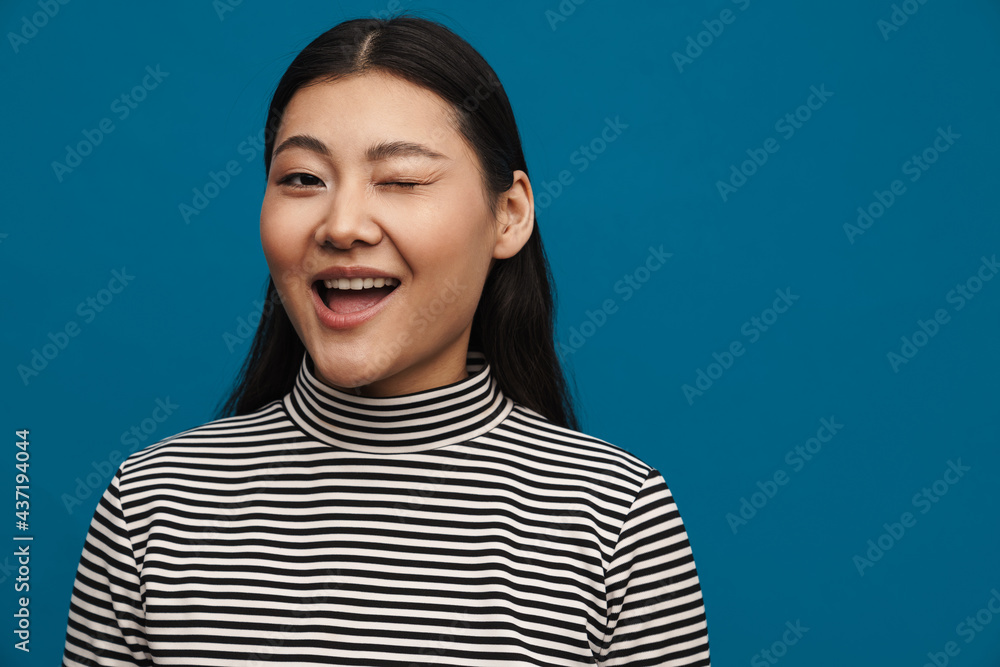Happy young asian woman in casual clothes standing Happy young asian woman in casual clothes standing