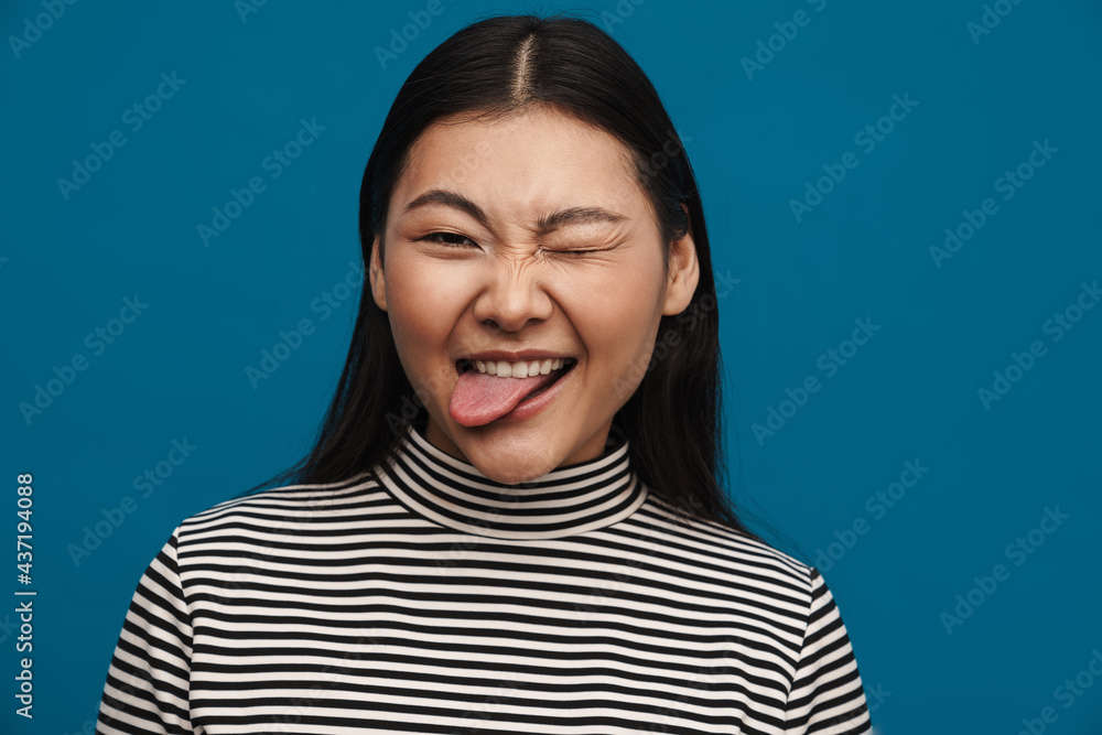 Happy young asian woman in casual clothes standing Happy young asian woman in casual clothes standing